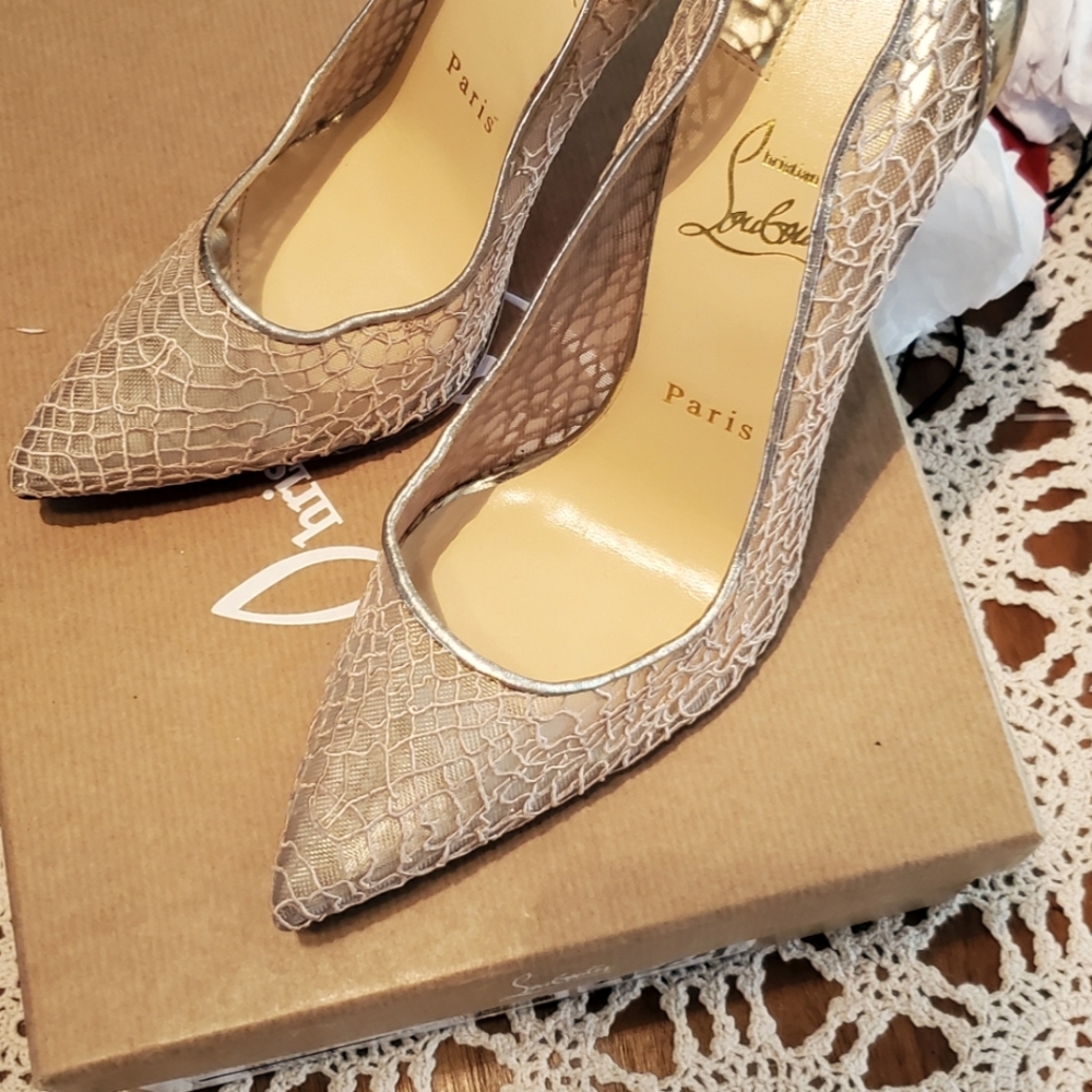 Brand new Gold Louboutin shoes.